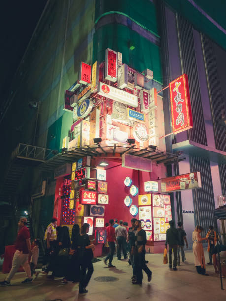 pedestrians walk in chinese district of the city center at night - architecture travel destinations vertical outdoors imagens e fotografias de stock