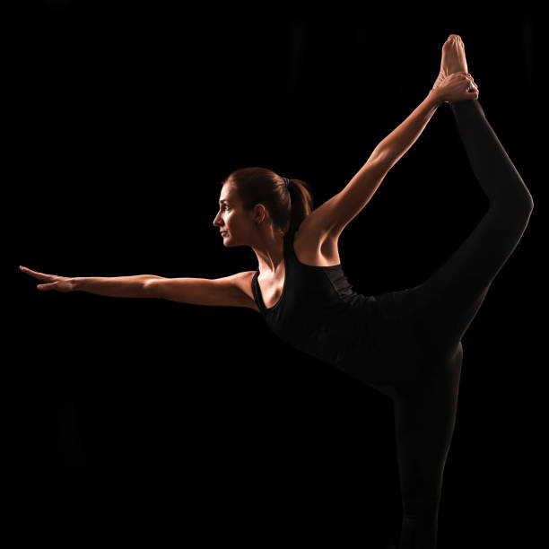 istock Woman stretching in Natarajasana pose 806734438