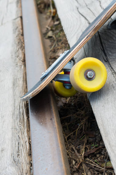 istock Skateboarding fail, stuck in railway / tram tracks 806736914