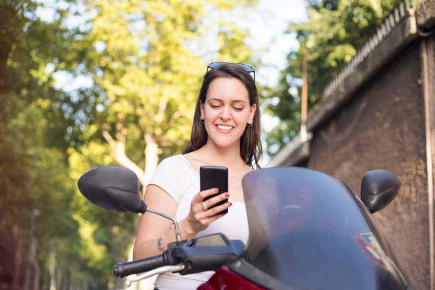 istock Young modern woman on motorcycle 806737344
