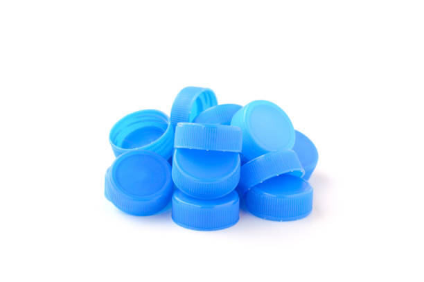 istock pile of blue plastic bottle cap on white background 806742146