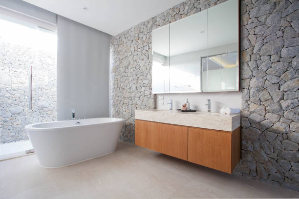 Luxury bathroom features basin,  and bathtub stock photo