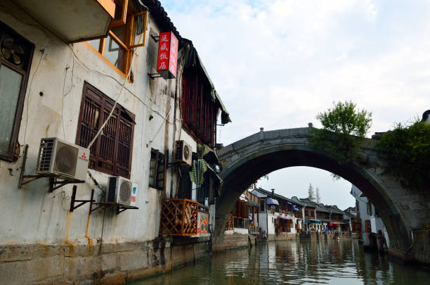 istock Old village by river in Shanghai with boat 806742420