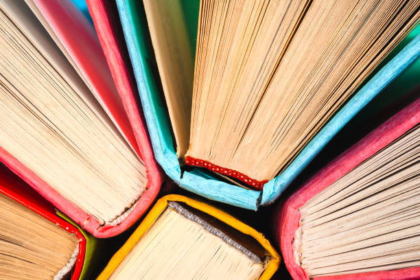 istock Top view of bright colorful hardback books in a circle. 806749102
