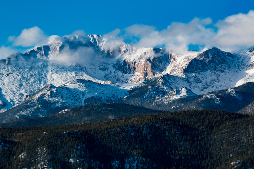 Pikes Peak buried in a new mantle of fresh white snow after a week of spring snowstorms.