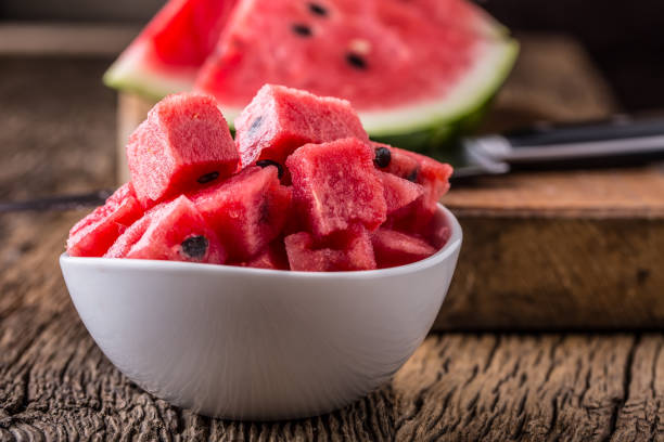 istock Water melon. Water melon sliced in bowl on wooden table 806757232