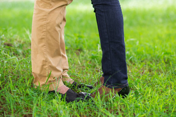 istock Close-up of couples legs opposite each other 806757638