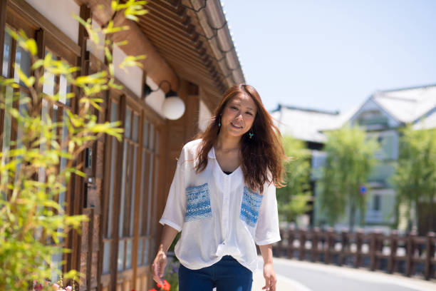 istock Young mother walking in old Japanese town 806761262