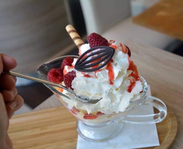 istock Vanilla ice cream with fresh raspberries, strawberries and pineapple. 806773898