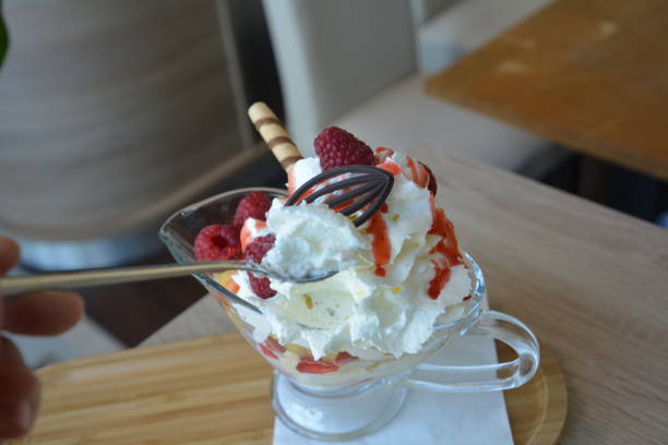 istock Vanilla ice cream with fresh raspberries, strawberries and pineapple. 806774004