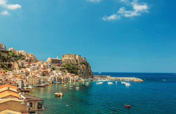 Scilla castle and harbor Scilla castle Ruffo, and harbor with fishing boats in Calabria, southern Italy castle scilla stock pictures, royalty-free photos & images