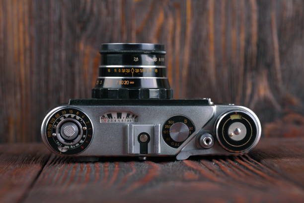 istock The old rangefinder camera on a wooden background. 806785296