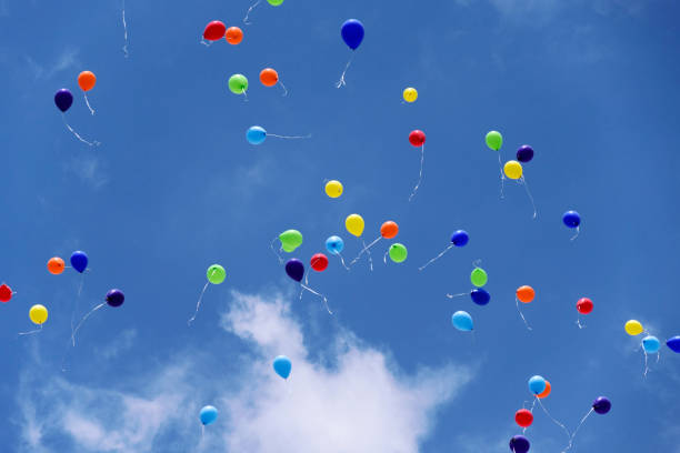 istock Colored flying balloons in the blue sky 806785366