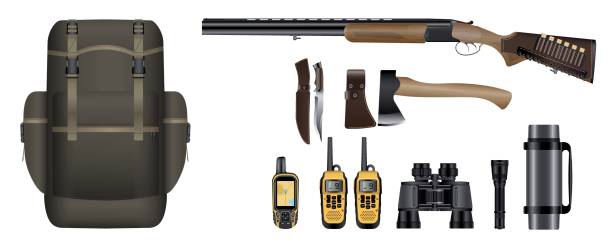 istock Set of realistic hunting equipment kit: backpack, rifle with cartridges, knife, hatchet, GPS navigator device,  walkie-talkie, binoculars, flashlight and thermos. 806799510