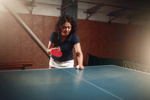 istock Table tennis, female player with racket and ball 806800094
