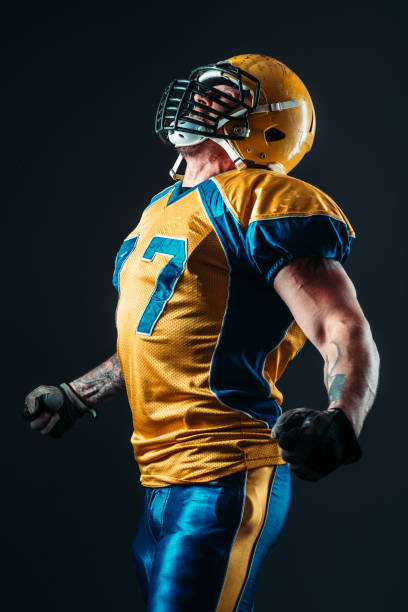 istock American football player in uniform and helmet 806807882