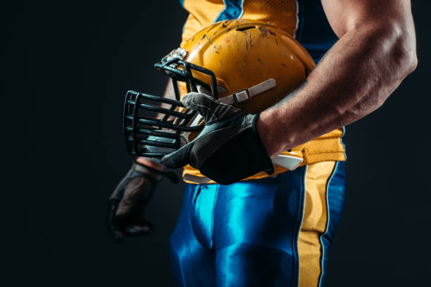 istock Player with american football helmet in hand 806807914