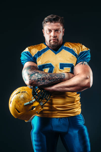 istock American football player with helmet in hand 806808020