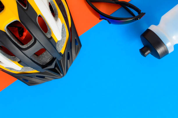 istock set bicycle equipment on a blue and orange paper background 806814752