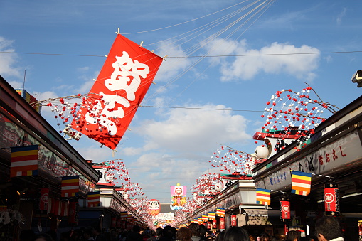 Tokyo, Japan - December 18, 2016: Asakusa’s Sensoji temple holds a Hagoita-Ichi Fair every year's end to sell good luck charm hagoita which are ornamental bats based on those used in a traditional New Year's game called hanetsuki (a bit like badminton, apparently).