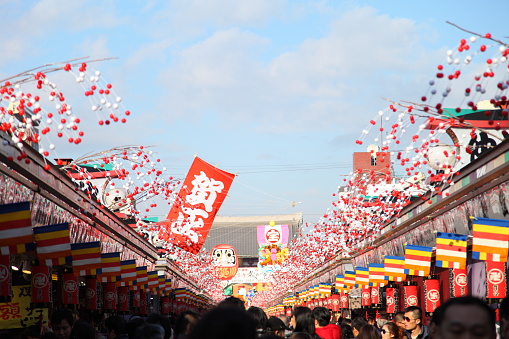 Tokyo, Japan - December 18, 2016: Asakusa’s Sensoji temple holds a Hagoita-Ichi Fair every year's end to sell good luck charm hagoita which are ornamental bats based on those used in a traditional New Year's game called hanetsuki (a bit like badminton, apparently).