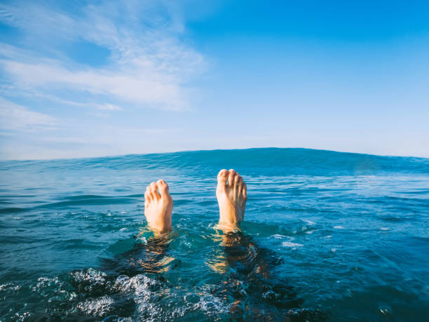 istock Blue wave in ocean and man from the first person. 806831756