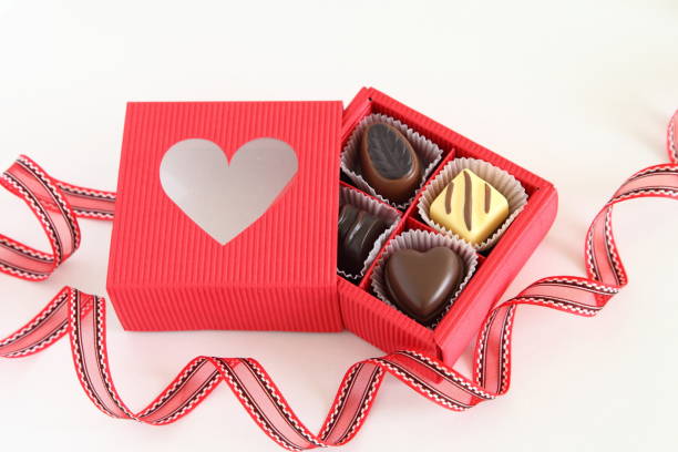 istock Red gift box with heart shaped window & Assorted Chocolate truffles for Valentine's Day 806835326