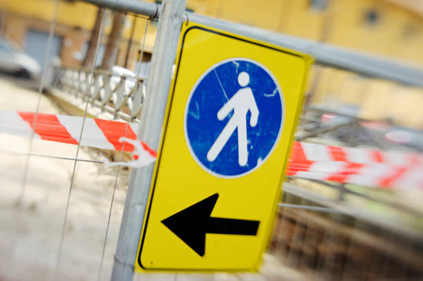 istock walk away - pedestrians and construction site 806838098