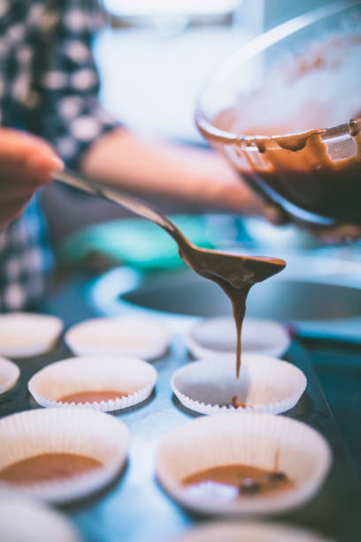 istock Woman making chocolate muffins. 806838442