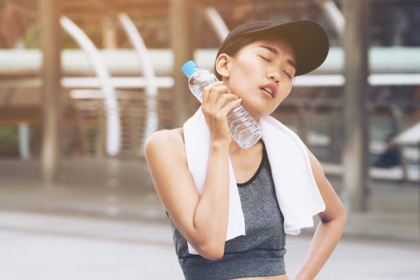 istock Sport woman with drinking water bottle 806851564