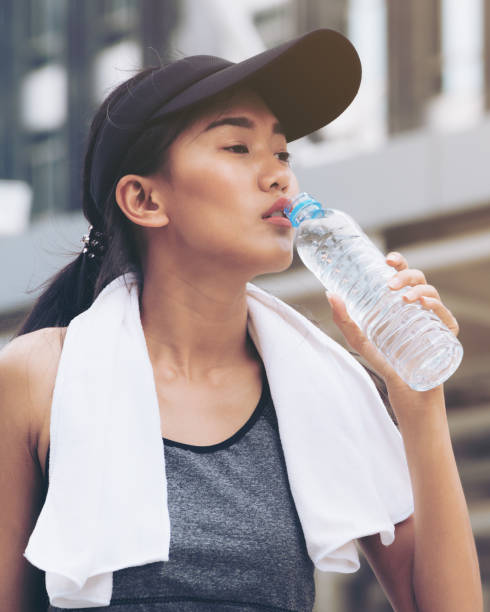 istock Sport woman with drinking water bottle 806851652