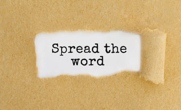 istock Text Spread the word appearing behind ripped brown paper 806854828