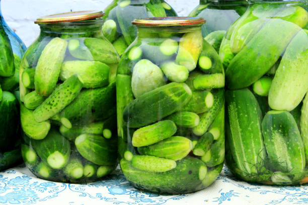 istock Cucumbers in the jars prepared for preservation 806861176