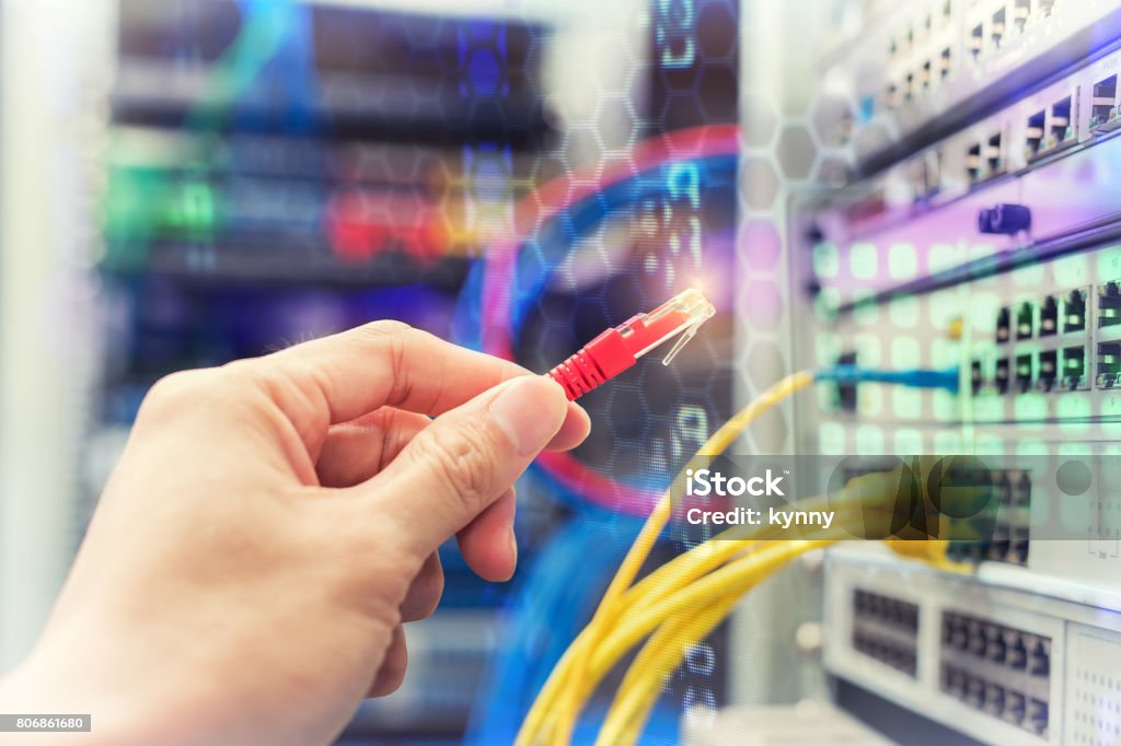person plugging in electricity cables Net - Sports Equipment Stock Photo