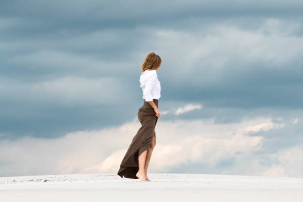 istock A girl in a long fluttering skirt 806864554