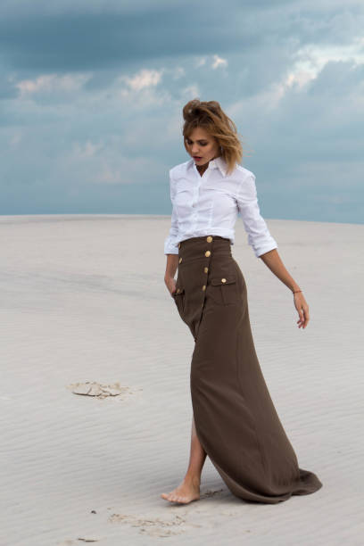 istock A refined girl walks slowly through the desert 806866912