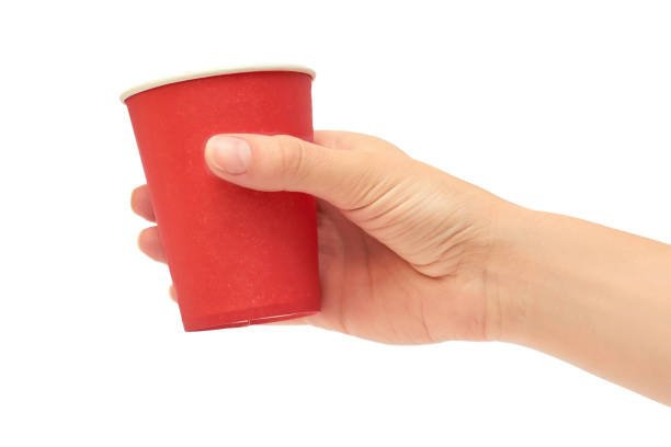 istock Female hands hold a cardboard or plastic disposable cup. Isolated on white background 806897688