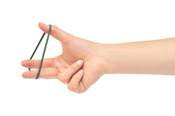 istock Female hands hold a rubber band. Isolated on white background 806897698