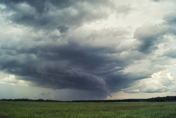 istock Storm cyclone over summer fields, hills and forests 806897940