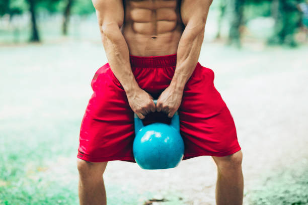 istock Male athlete with kettle bell 806898006