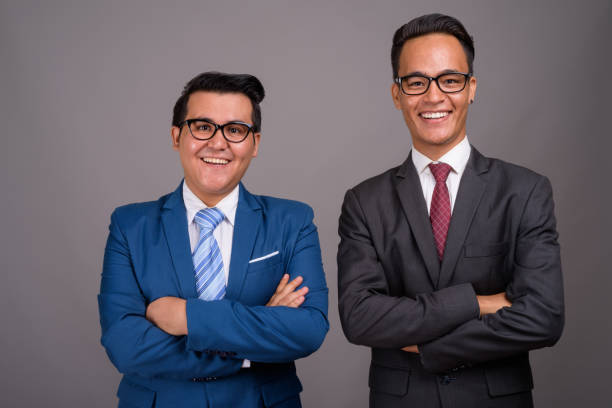 istock Studio shot of two young multi-ethnic businessmen against gray background 806898144