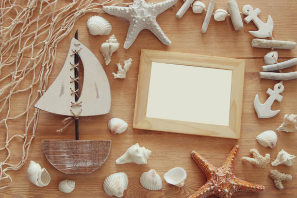istock Nautical concept with sea life style objects on wooden table. Top view 806904180