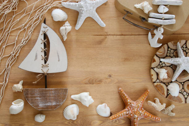 istock Nautical concept with sea life style objects on wooden table. Top view. 806904316