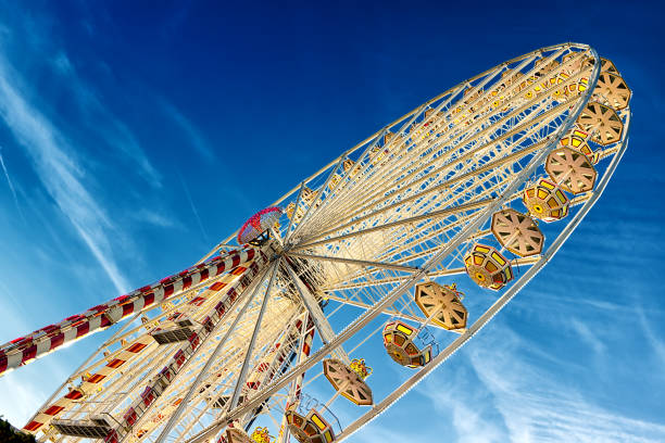 istock circular big ferris wheel on blue sky background 806906888