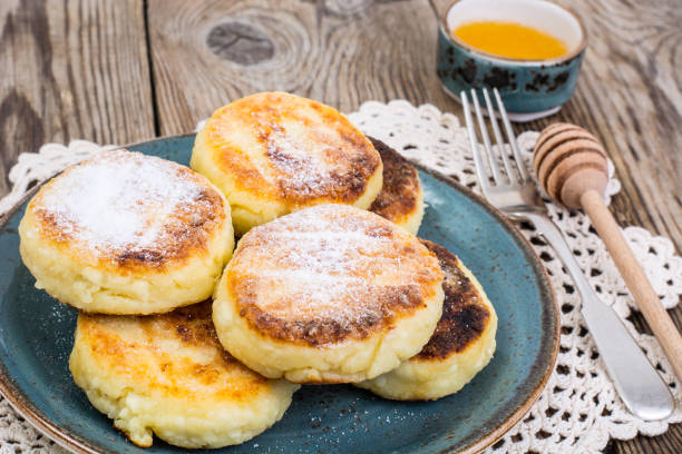 istock Breakfast. Russian traditional cottage cheese pancakes in the pl 806906894