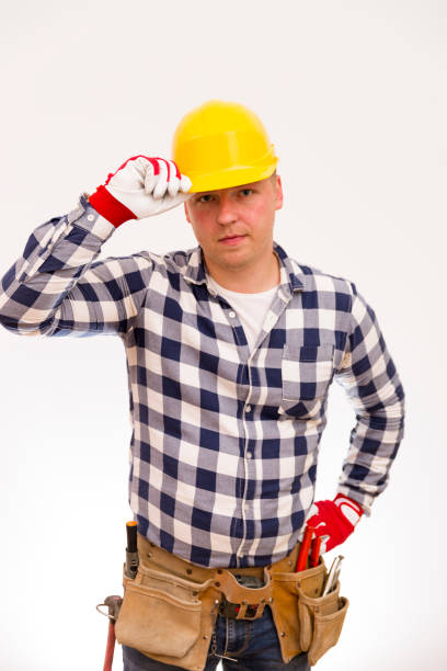 istock Handyman with a tool belt. House renovation service. 806912278