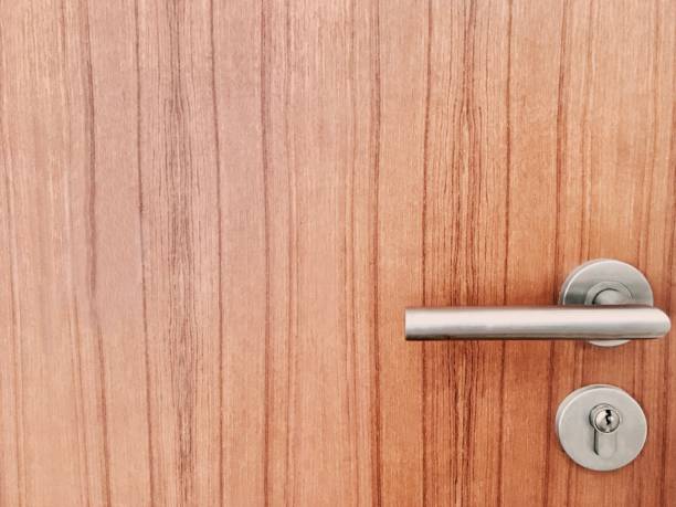 istock Lock and Door Handle on Brown Wooden Door 806914810