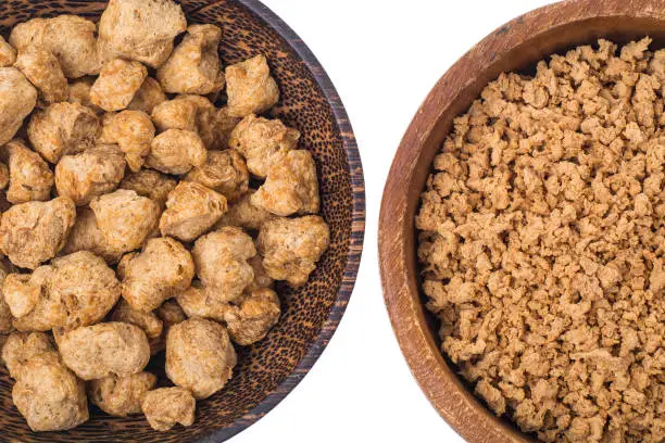 Photo of Set of wooden bowls with soy meat pieces