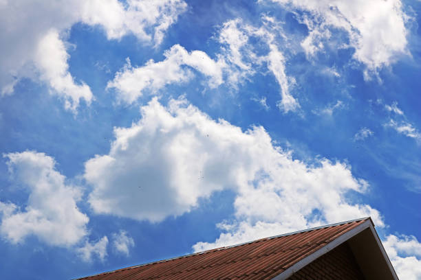 istock Part of roof and cloudy sky 806944502