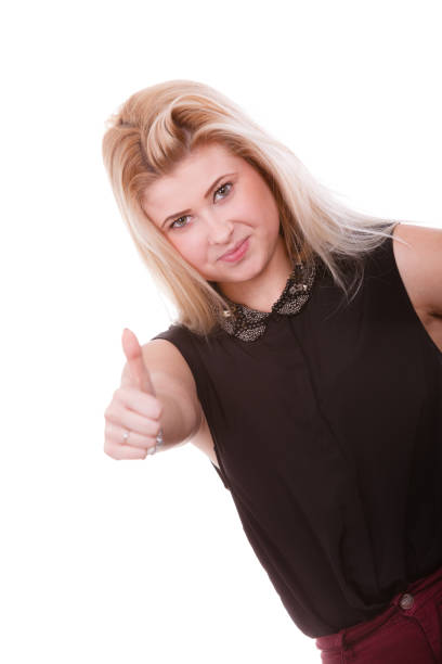 istock Smiling blonde woman making thumb up gesture 806964946